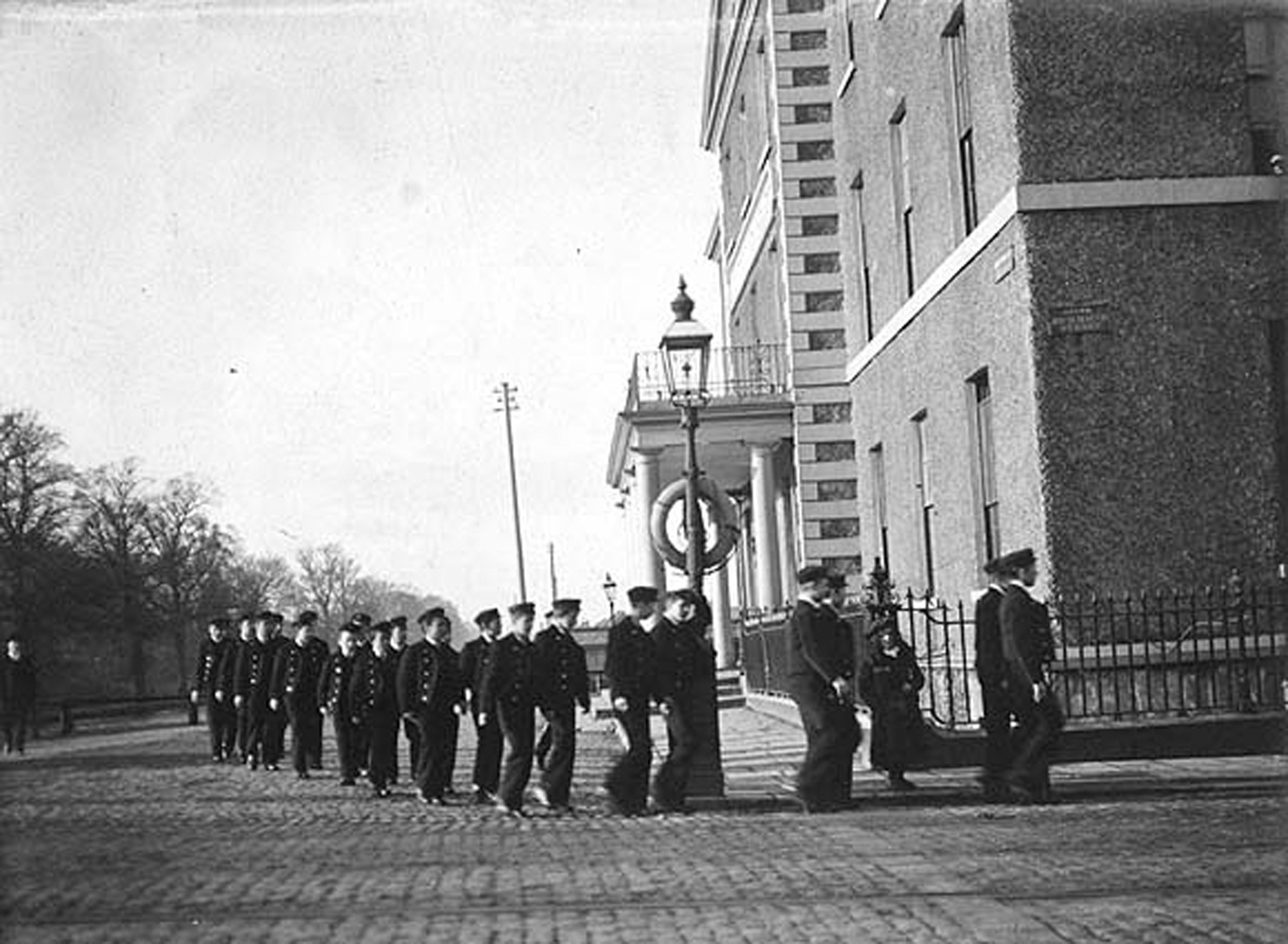 Group of boys in uniform marching at the corner of Portobello and Richmond Street South