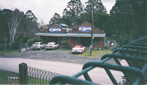 Building, trees, cars, fence | by Matthew Paul Argall