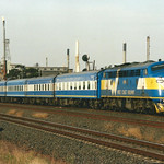 () Warnambool Pass B76 leading WCR Melbourne to Warnambool Service at Geelong North on 17th Jan. 2003.