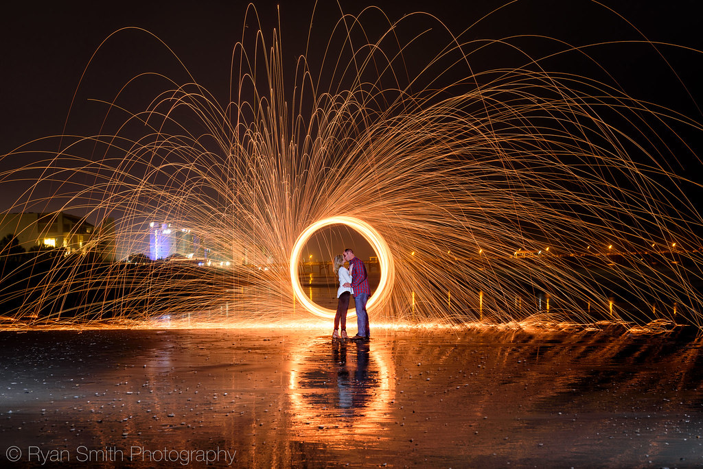 Engagement picture fun spinning steel wool on fire