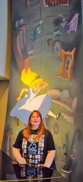 Karen in Front  of Alice in Wonderland Mural