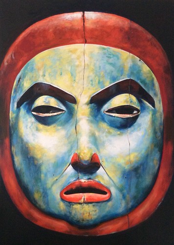 Blue mask face framed by a red circular border