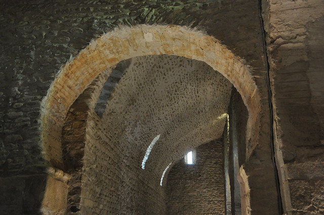 Codalet. St. Miquel de Cuixà Abbey. Church. Horseshoe arch and vaults of the aisle. 10th-11th C.