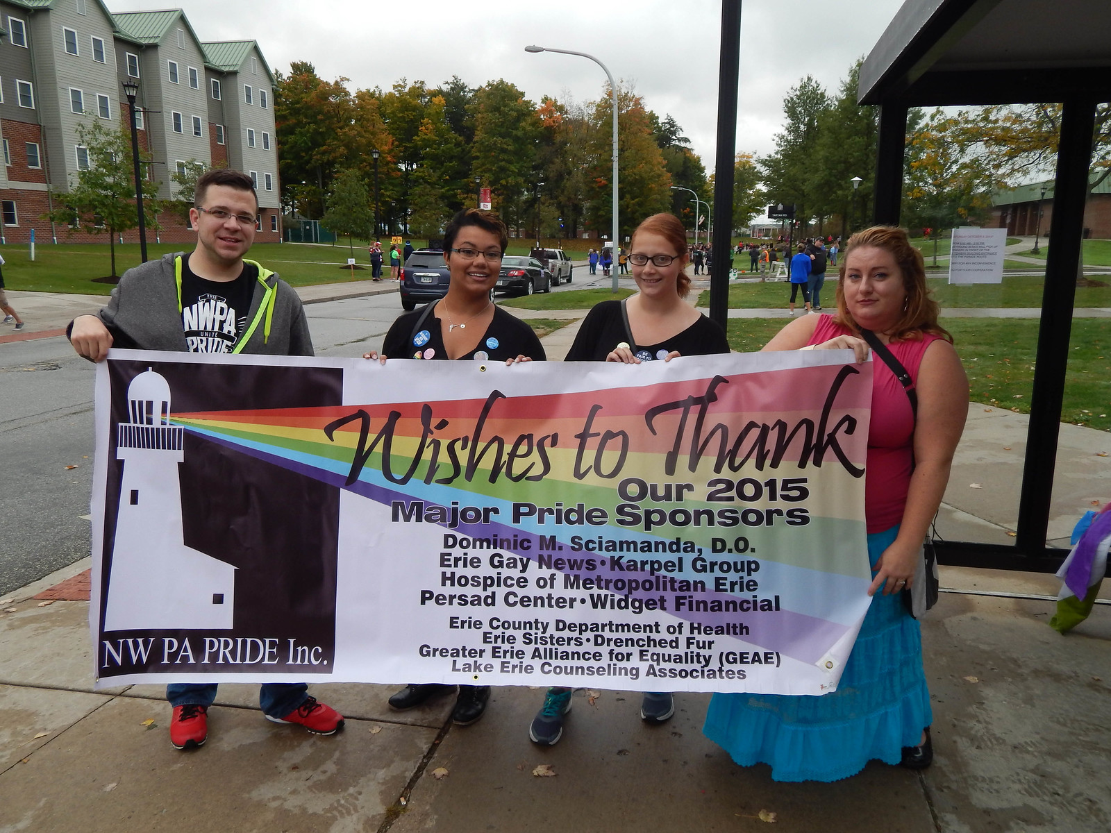 NW PA Pride Alliance board members and Identity members with NWPAPA banner