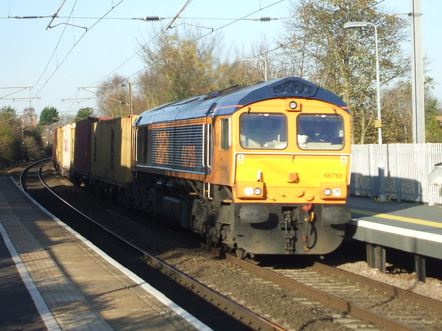 66 768 hauls a Felixstowe bound Container Train through Needham Market Station.