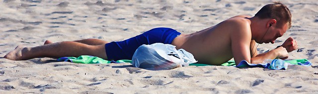 Man in Blue Swim ware on beach