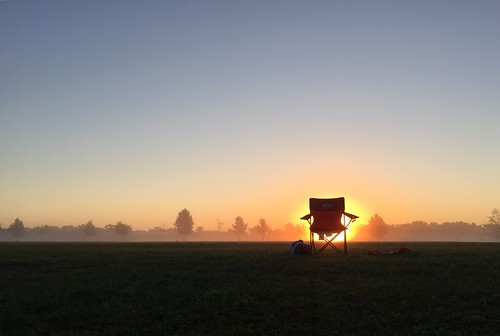 Sunrise by RKop, the chair must have been left from last night soccer practice... there was no one in sight raphaelko