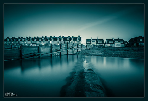 water sea wet waves silk beach sand rock fence building house windows long exposure blue photoshop processing canon eos 70d sigma 1020mm lens whitstable bubble kent south east uk england britain