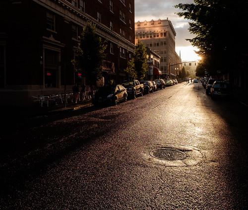 street sunset sun reflection wet rain oregon portland us glare unitedstates pavement