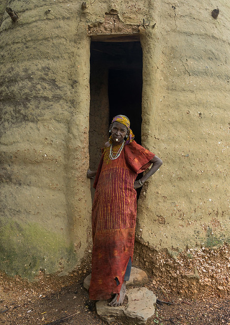 Togo, West Africa, Nadoba, woman in front her traditional tata somba house