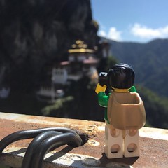 We both couldn't stop capturing this moment at the monastery. How many people does it take to make sure #Legopau isn't' blown away by the wind? Three! #Bhutan #travel #lego #love
