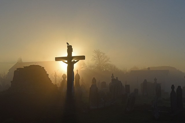 Foggy Sunrise in Kilfeacle, 2nd Dec 2016 -----  Large cross, Old Church ruins with more recent Church and Norman Motte in background at Kilfeacle Tipperary