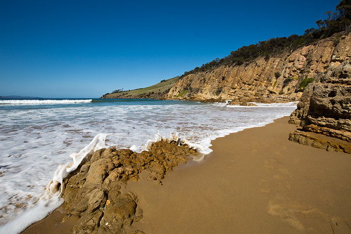 ocean sea beach water coast sand rocks waves tide bluesky tasmania coastline clifton cliftonbeach