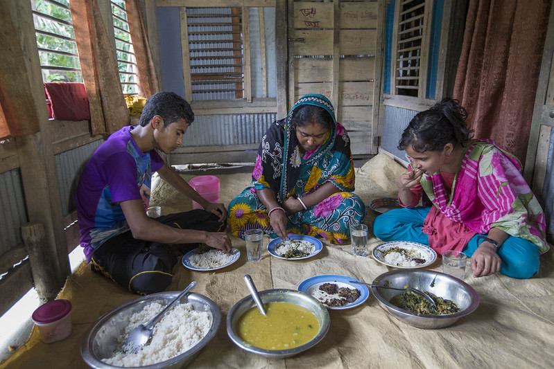 A family eats a diverse lunch complete with nutrient-rich mola fish in Khulna, Bangladesh. Photo by Yousuf Tushar.