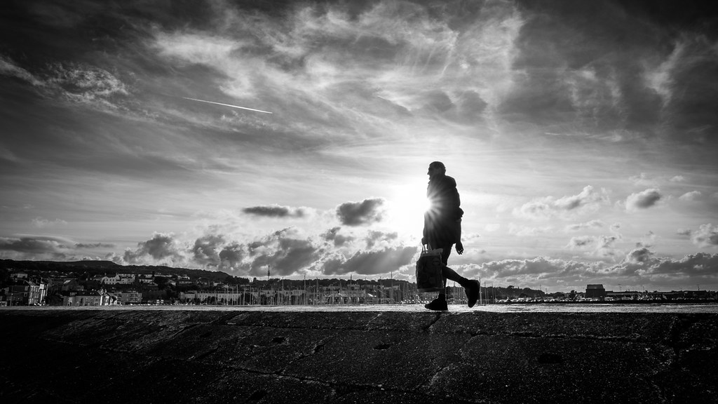A man at sunset - Howth, Ireland - Black and white street photography