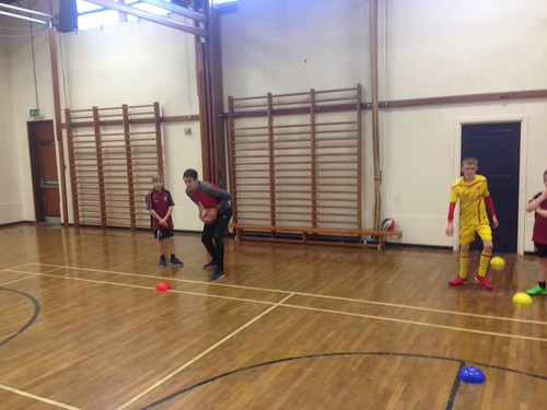 Sunrise basketball with Year 8 by Cullybackey College Photos, Zak Smyth and Jamie Morrow look on at a demonstration of the 'pivot' technique