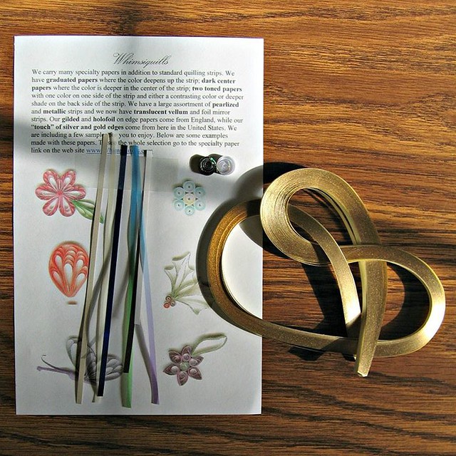 Excuse a photo taken in direct sunlight, but I wanted you to see the shine on these Lake City 'A Touch of Gold' quilling papers I just ordered from Whimsiquills. I daresay the metal edge is shinier than it used to be on this type of strip so perhaps the p