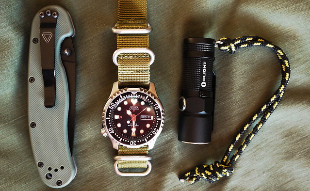Ontario RAT-1 knife, Citizen NY0400 watch, Olight S10 flashlight