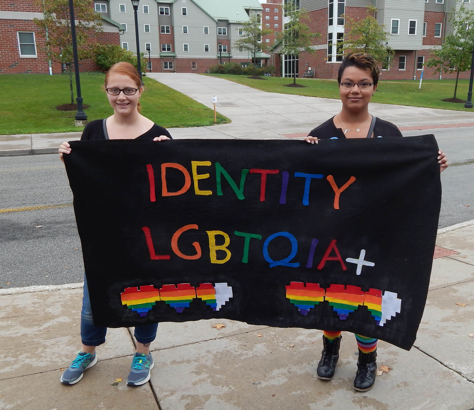 Members of Identity with banner
