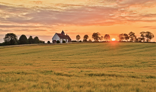 Heavenly Light by Langstone Joe, Sunrise at the old Saxon church of St Hubert's at Idsworth. The church dates from 1053, almost 1000