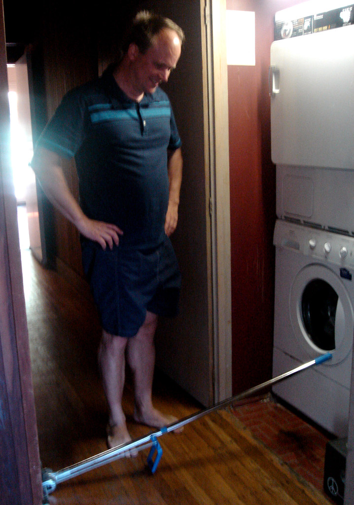 Alex fixes the washing machine. | (it was leaking) Geotagged\u2026 | Flickr