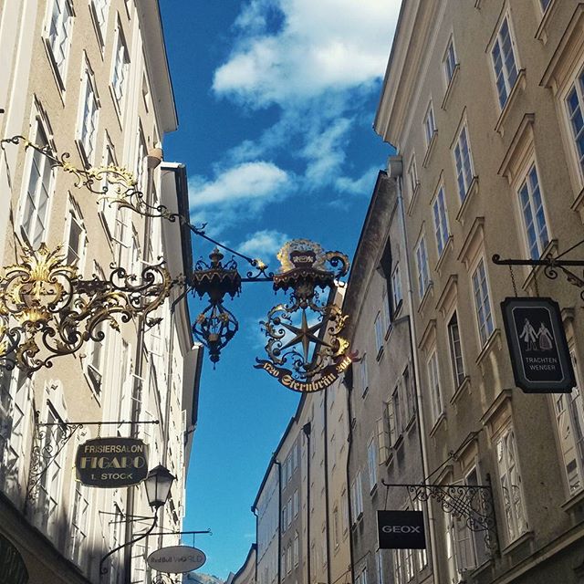 Blue skies and old-fashioned store signs in #Salzburg #Austria