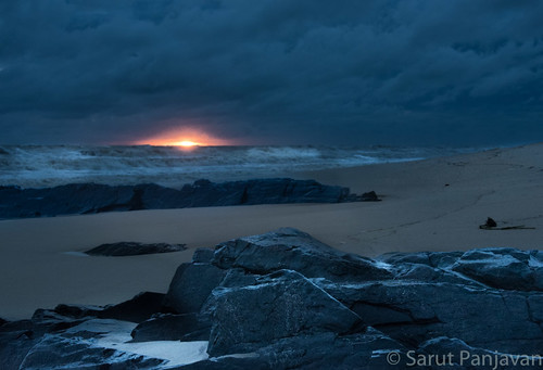 red sun beach sunrise rocks surf waves cloudy
