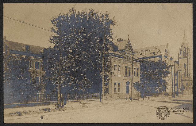 Real Photo Postcard: North Wheeling Hospital and Sacred Heart Church, Main Street