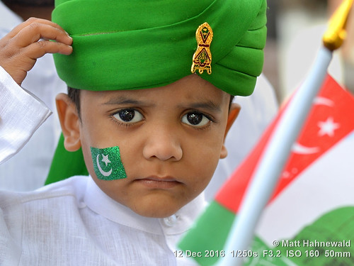 primelens portrait street green cultural child travel festival celebration mawlid posing saluting cute eyes traditional religious face facingtheworld turban head hyderabad india islam boy birthday nikond3100 outdoor painted telangana toddler 50mm childreneyes expression prophetbirthday islamic flag muslim nikkorafs50mmf18g clarity catchlights person emotional closeup cheek seveneighthsview eyelashes matthahnewald headshot colorcolour lookingatviewer colorfulcolourful