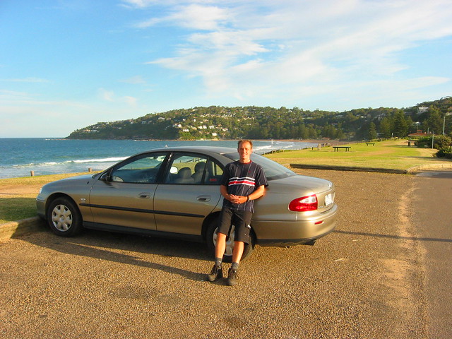 Me restong on our rental car on Palm Beach