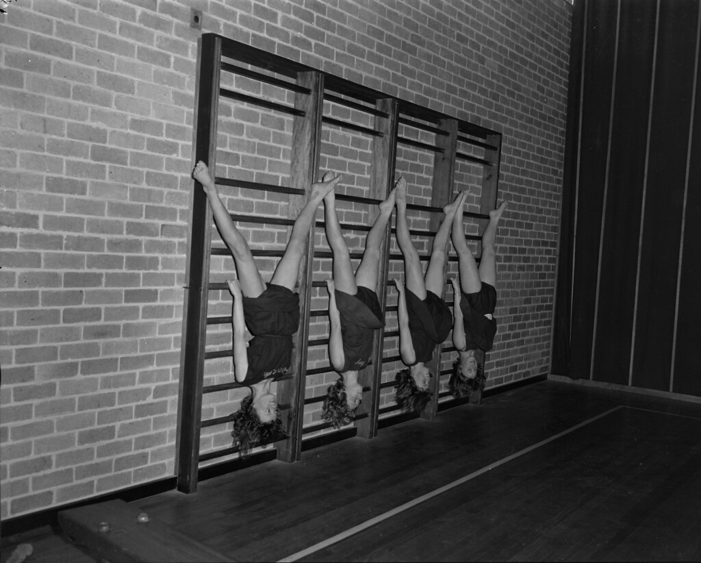 Students use equipment in gymnasium, Preston Girls School