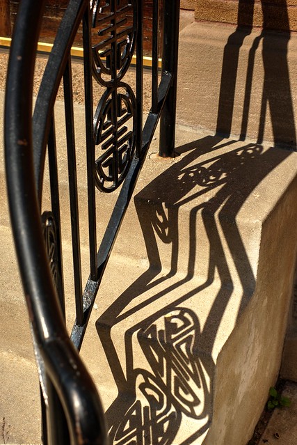 Intricate railing shadows.