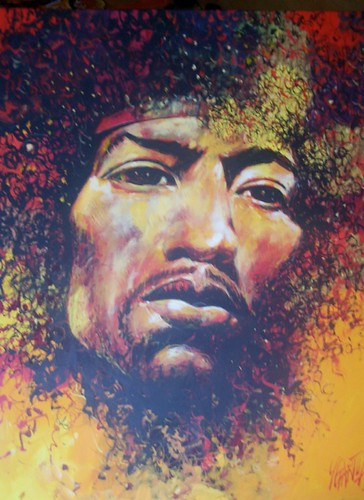 Close-up curly-haired musician in purple and ochre
