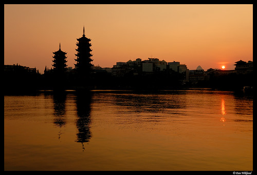 china sunset orange sun lake reflection skyline pagoda cityscape guilin buddhist d200 pagodas silhuette guanxi twinpagodas 2011 gulin shanlake sunpagoda moonpagoda pagodamoon