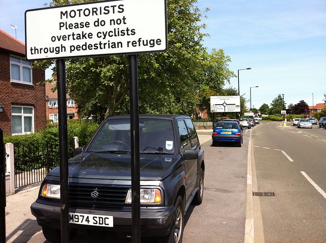 Motorists Please do not overtake cyclists through pedestrian refuge
