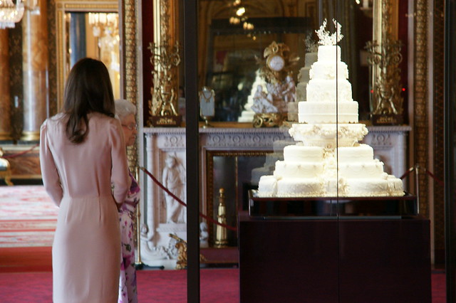 The Queen and The Duchess of Cambridge look at the wedding cake