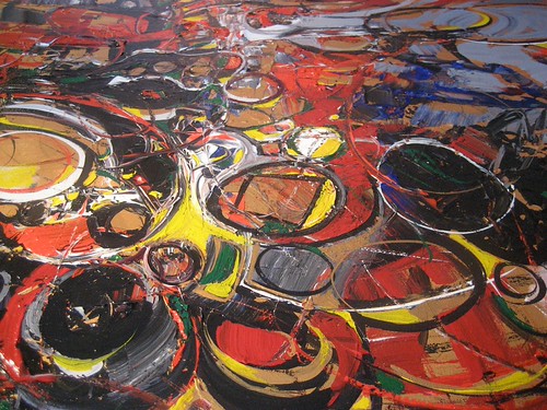 Large overlapping circular outlines in gold and red