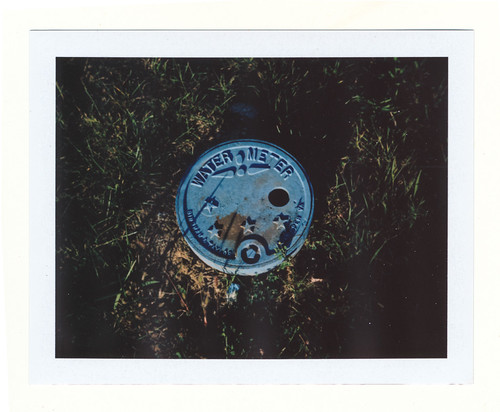 blue meter by vistavision, Blue-painted water meter cover at sunset. South Park neighborhood, Dayton, Ohio. Fuji FP-100C film,