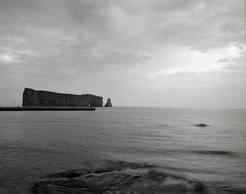 Rocher Percé Sunrise #2 (b/w) by wanderingYew2 (thanks for 7M total views!), 1 sec exposure.  Shot with Ilford 125.

<a href="http://loc.alize.us/#/flickr:6247371234" rel="nofol