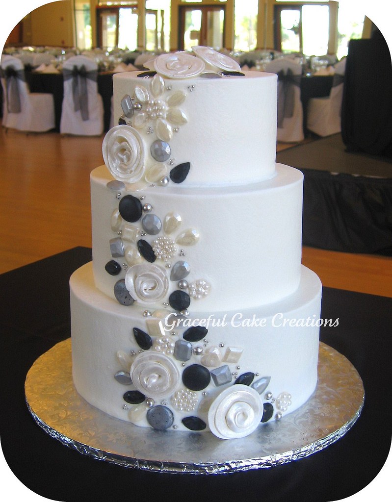 White Wedding Cake with Silver, Black and Pearl Jewels accented with Whimsical Roses