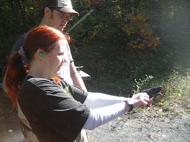20111016 - 1 - shooting range - 1036 - Carolyn tries to shoot our gun for the first time (48s) - MVI_3818