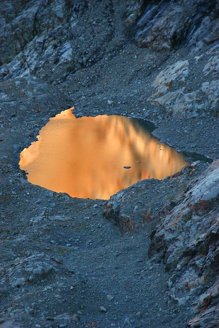 Eldorado??? sunset rock reflection in a glacier lake at Bernese Alps
