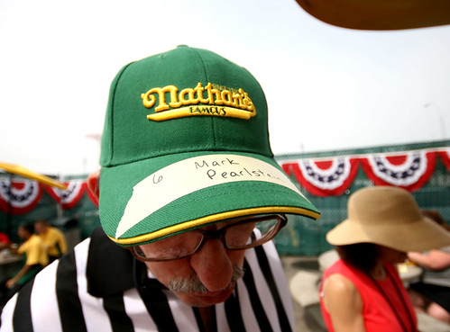 his name is on a Nathan's hat