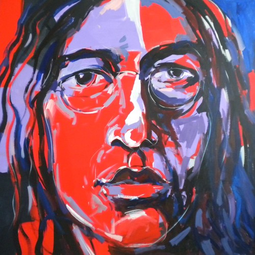 Musician wearing glasses in red and pale blue