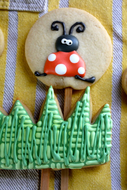 lady bug and grass cookie pops