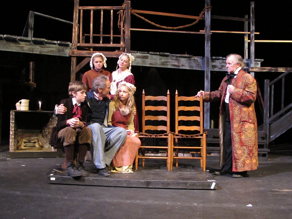 The Cratchits mourn Tiny Tim while Scrooge looks on. A Christmas Carol, Brazosport Center Stages, November, 2011.