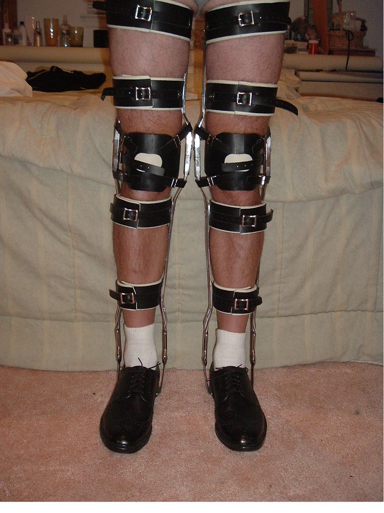 Black 4 Cuffed Leg Braces with Bail Locks with Mens Shoes.