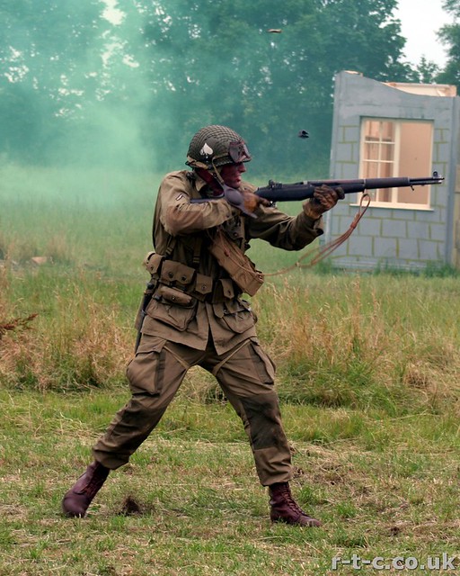 American paratrooper firing his M1 Garand