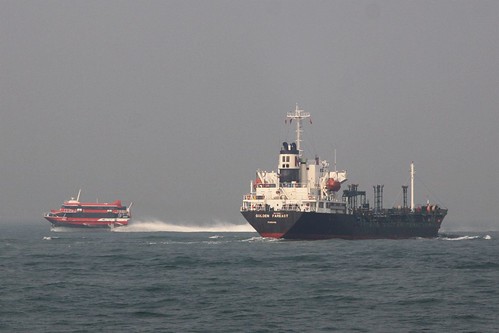 TurboJet hydrofoil cuts across the bow of tanker 'Golden Fareast' off Hong Kong Island
