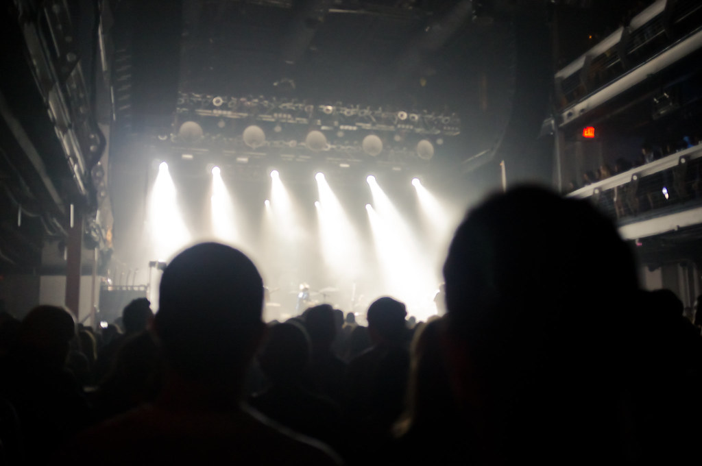 Concert crowd silhouetted before spotlights during a Portugal. The Man show at Terminal 5 in New York.